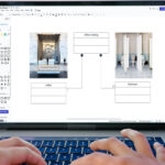 person on laptop creating a uml class diagram