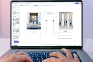 person on laptop creating a uml class diagram